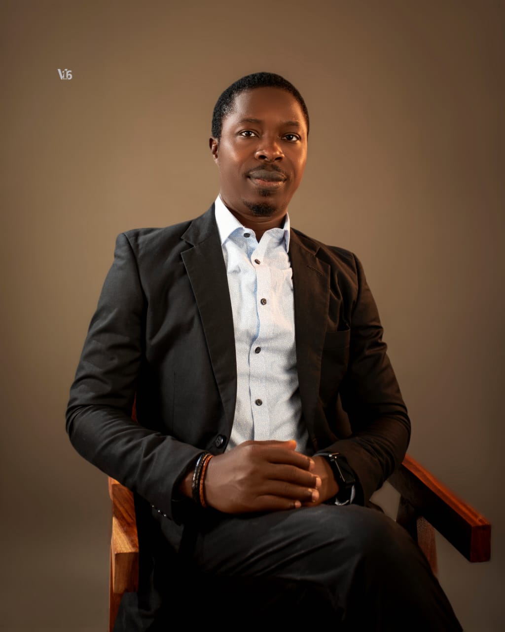 Portrait of Afolabi Lookman Oloko seated in a dark suit
