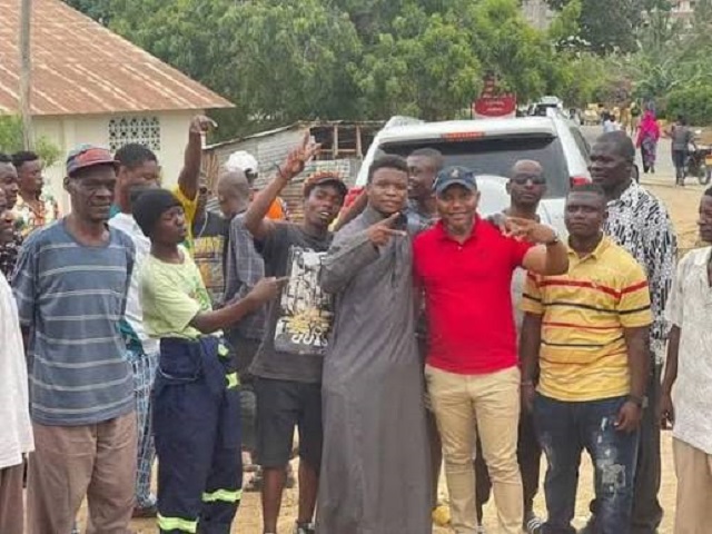 Community members gathered around Afolabi Lookman Oloko during an engagement