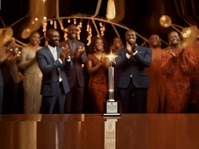 Recognition event with an award presented in front of guests